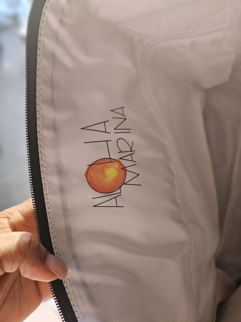 ALOHA Collection Travel Pouch in Light Pink with Orange Logo